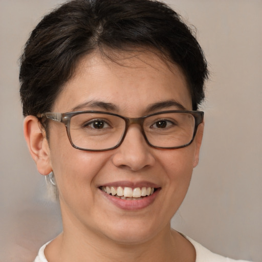 Joyful white adult female with short  brown hair and brown eyes