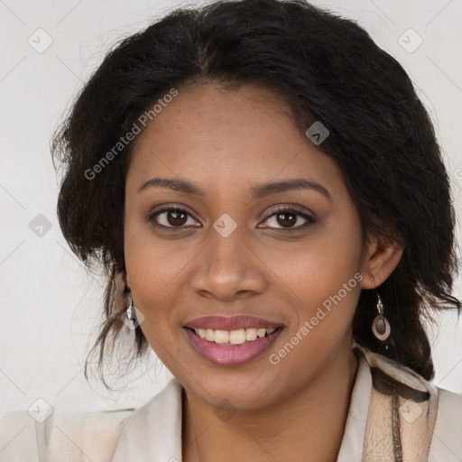 Joyful black young-adult female with long  brown hair and brown eyes