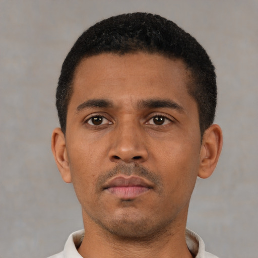 Neutral black young-adult male with short  black hair and brown eyes