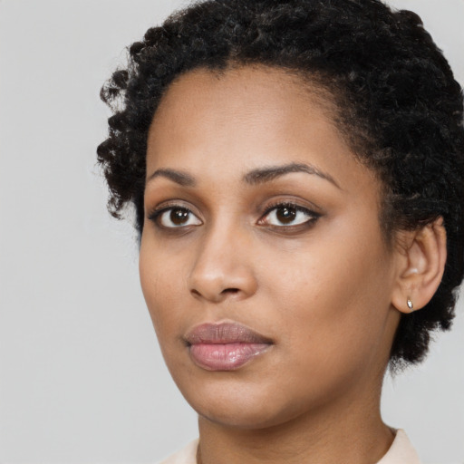 Neutral black young-adult female with short  brown hair and brown eyes