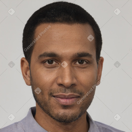 Joyful black young-adult male with short  black hair and brown eyes