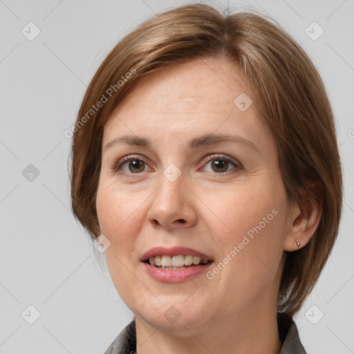 Joyful white adult female with medium  brown hair and grey eyes