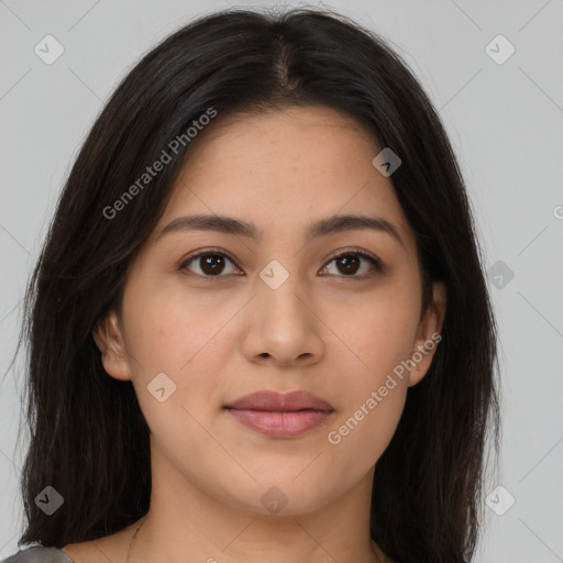 Joyful latino young-adult female with long  brown hair and brown eyes