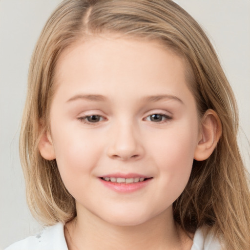 Joyful white child female with medium  brown hair and grey eyes