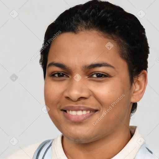 Joyful latino young-adult female with short  brown hair and brown eyes