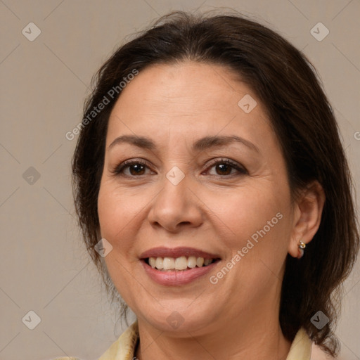 Joyful white adult female with medium  brown hair and brown eyes