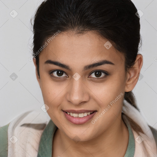 Joyful latino young-adult female with medium  brown hair and brown eyes