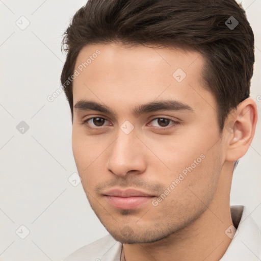 Neutral white young-adult male with short  brown hair and brown eyes