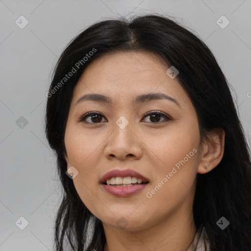 Joyful asian young-adult female with long  black hair and brown eyes