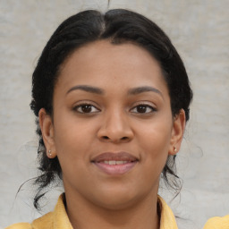 Joyful latino young-adult female with medium  brown hair and brown eyes