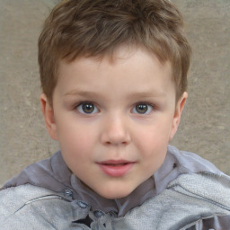 Joyful white child male with short  brown hair and brown eyes