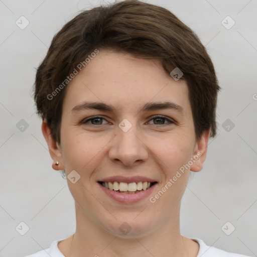 Joyful white young-adult female with short  brown hair and grey eyes