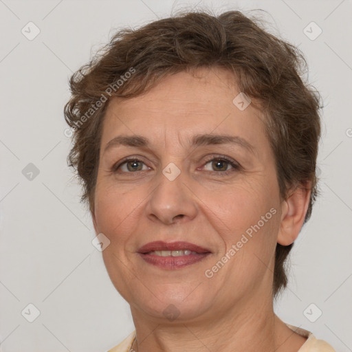 Joyful white adult female with short  brown hair and brown eyes