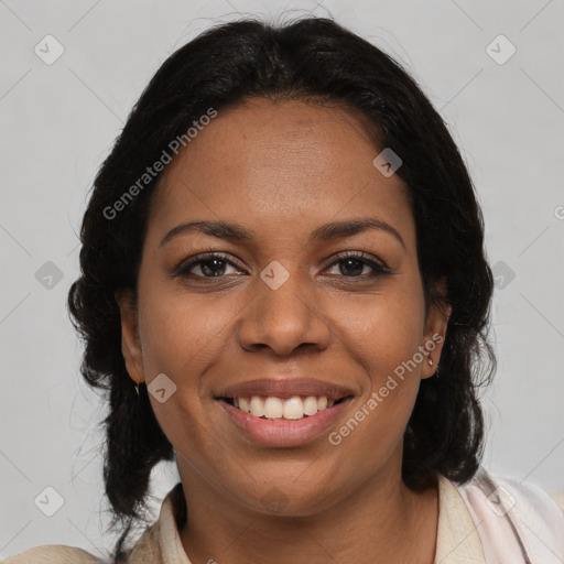 Joyful black adult female with medium  brown hair and brown eyes