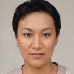 Joyful asian young-adult female with short  brown hair and brown eyes