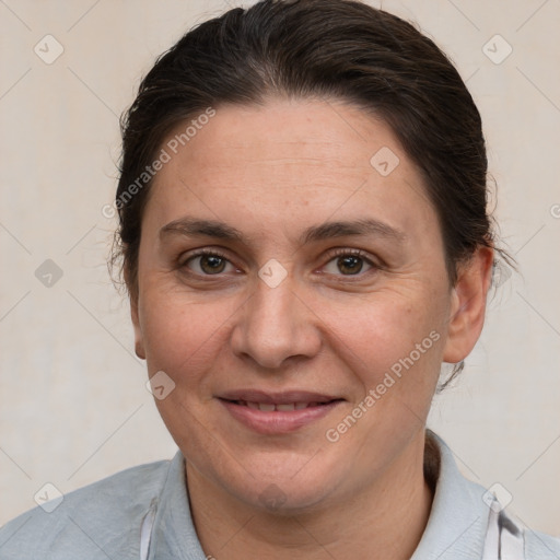 Joyful white adult female with short  brown hair and brown eyes