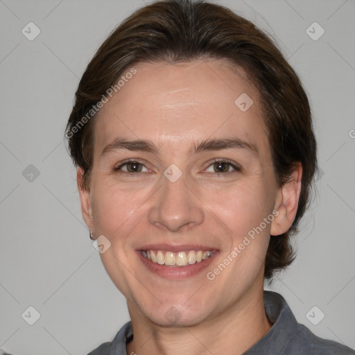 Joyful white adult female with medium  brown hair and grey eyes