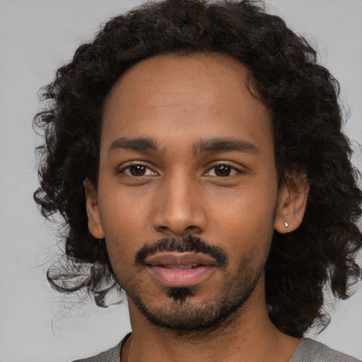 Neutral black young-adult male with medium  black hair and brown eyes