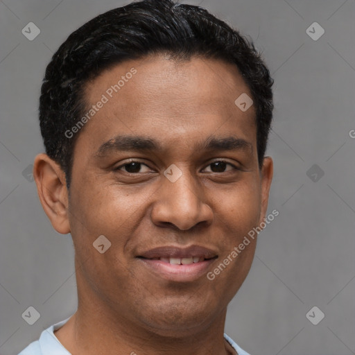 Joyful latino young-adult male with short  brown hair and brown eyes