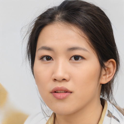 Neutral asian young-adult female with medium  brown hair and brown eyes
