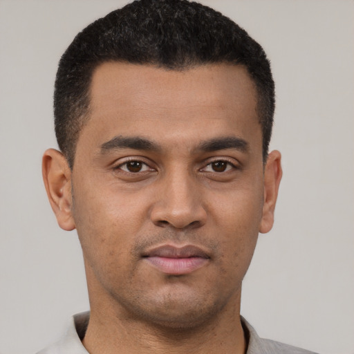 Neutral latino young-adult male with short  black hair and brown eyes