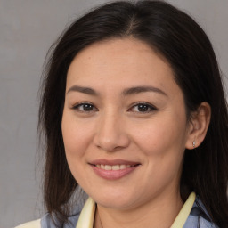 Joyful asian young-adult female with medium  brown hair and brown eyes