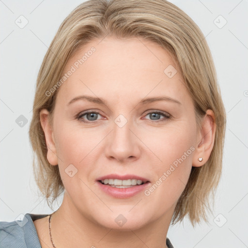 Joyful white adult female with medium  brown hair and blue eyes