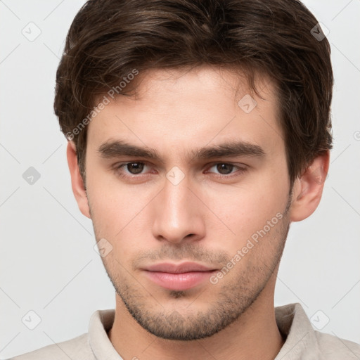 Neutral white young-adult male with short  brown hair and brown eyes