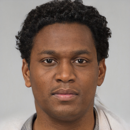 Neutral black young-adult male with short  brown hair and brown eyes
