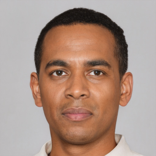Neutral black young-adult male with short  black hair and brown eyes