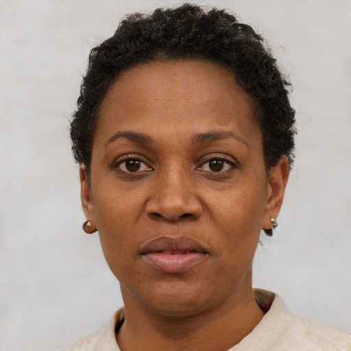 Neutral black adult female with short  brown hair and brown eyes