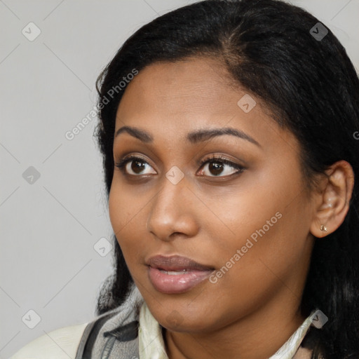 Neutral black young-adult female with medium  black hair and brown eyes