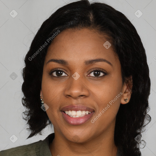 Joyful black young-adult female with medium  black hair and brown eyes