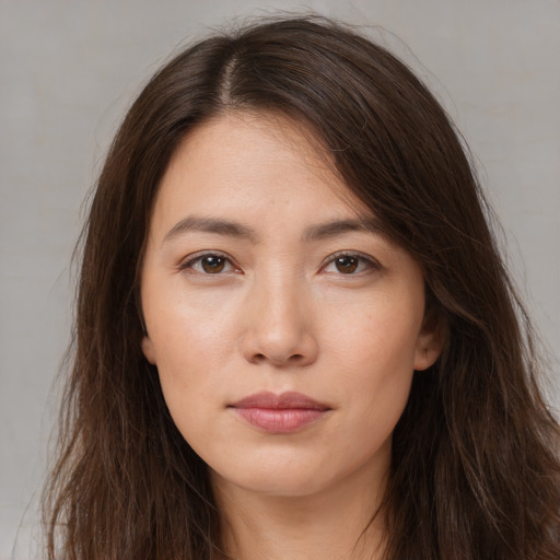 Neutral white young-adult female with long  brown hair and brown eyes