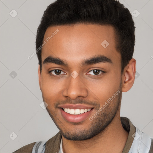 Joyful latino young-adult male with short  brown hair and brown eyes