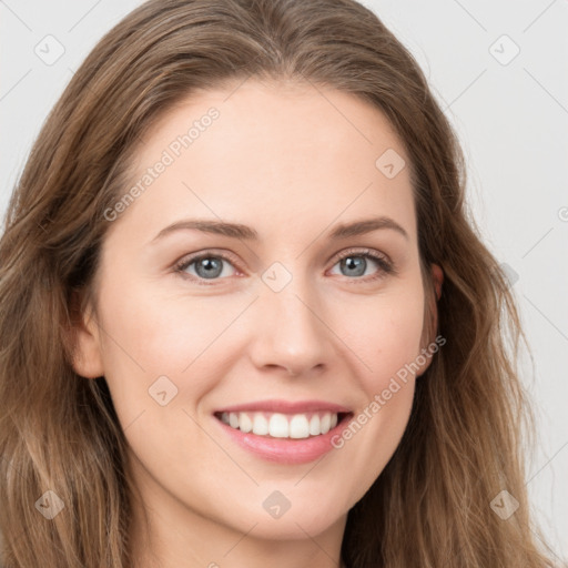 Joyful white young-adult female with long  brown hair and green eyes