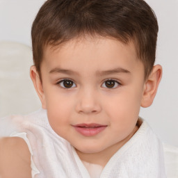 Joyful white child male with short  brown hair and brown eyes