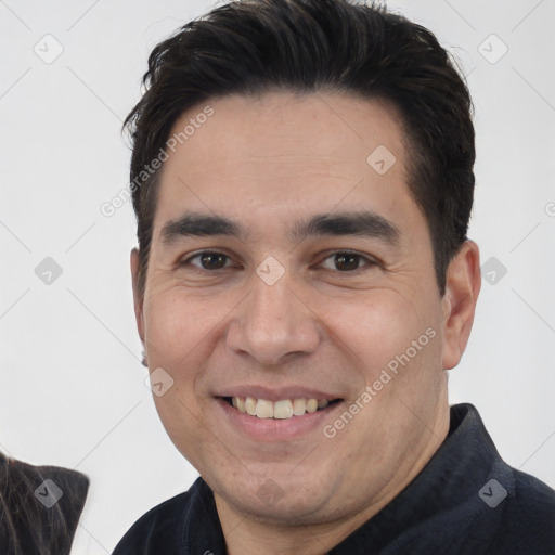 Joyful white young-adult male with short  black hair and brown eyes