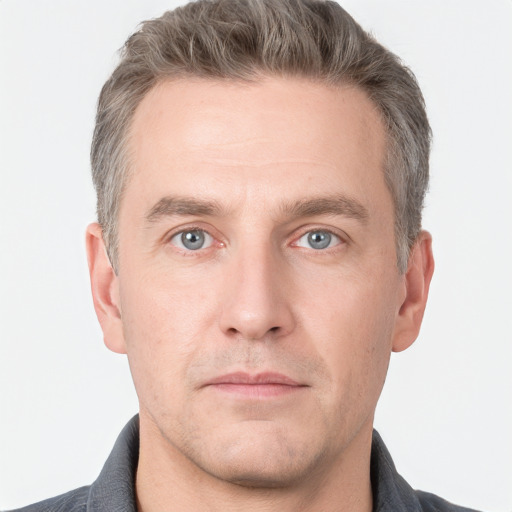 Neutral white adult male with short  brown hair and grey eyes