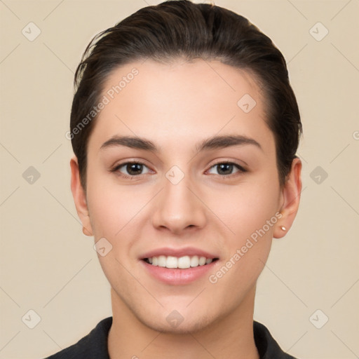 Joyful white young-adult female with short  brown hair and brown eyes