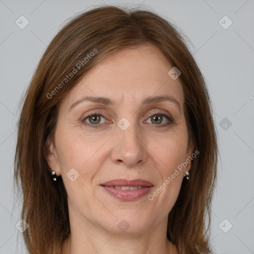 Joyful white adult female with medium  brown hair and brown eyes