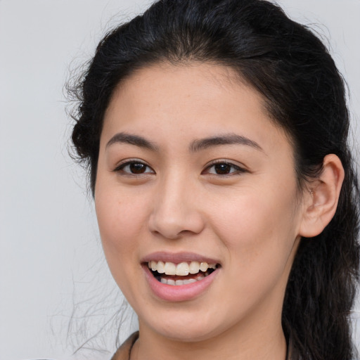 Joyful white young-adult female with long  brown hair and brown eyes