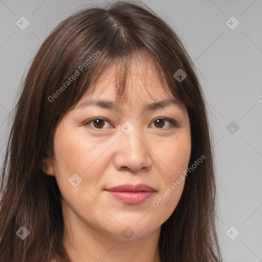 Joyful white adult female with long  brown hair and brown eyes