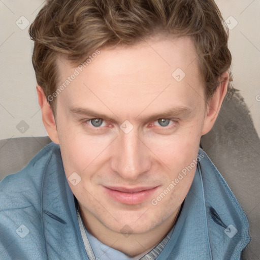 Joyful white adult male with short  brown hair and blue eyes