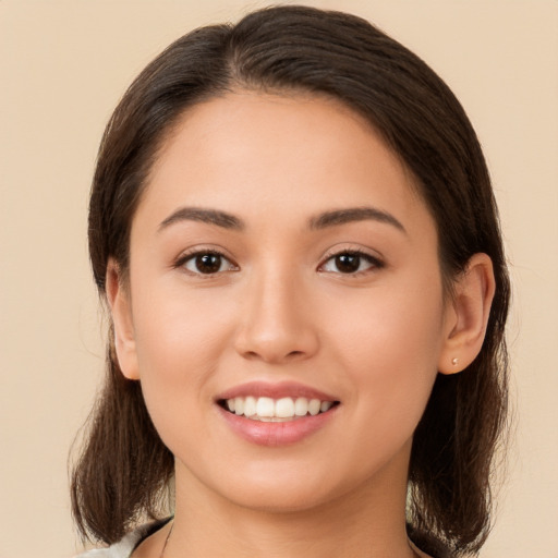 Joyful white young-adult female with medium  brown hair and brown eyes