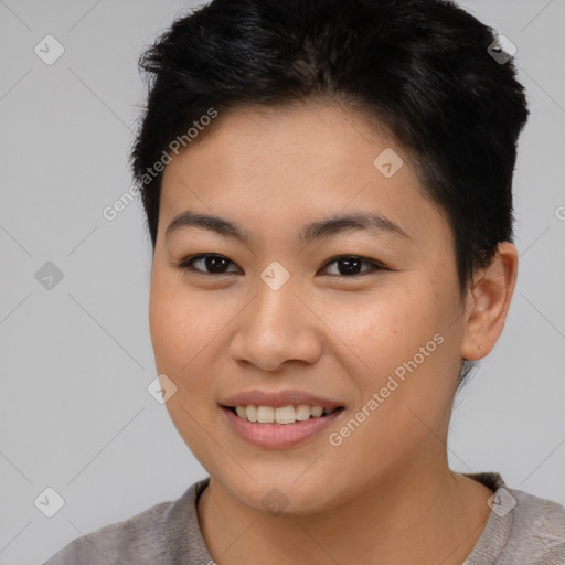 Joyful asian young-adult female with short  brown hair and brown eyes