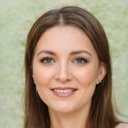 Joyful white young-adult female with long  brown hair and green eyes