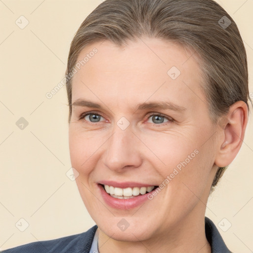 Joyful white adult female with short  brown hair and brown eyes