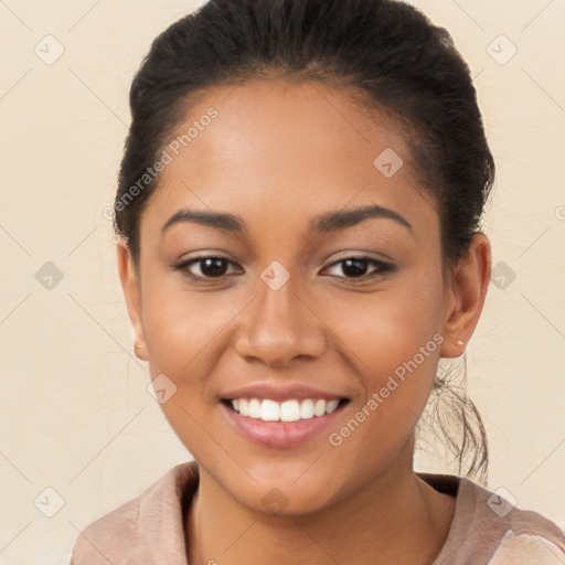 Joyful latino young-adult female with short  brown hair and brown eyes