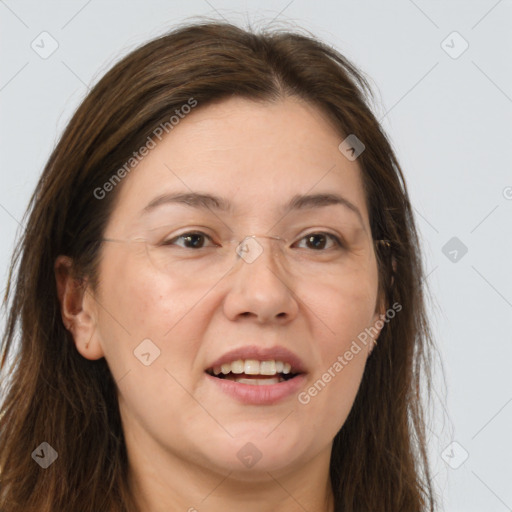 Joyful white adult female with long  brown hair and grey eyes